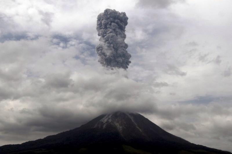 Mount Sinabung on the Indonesian island of Sumatra spews hot gas and rock several miles in the air