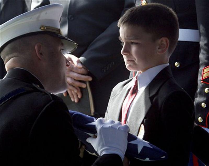 Who Says War is fine \"Eight-year-old Christian Golczynski accepts the flag for his father\"
