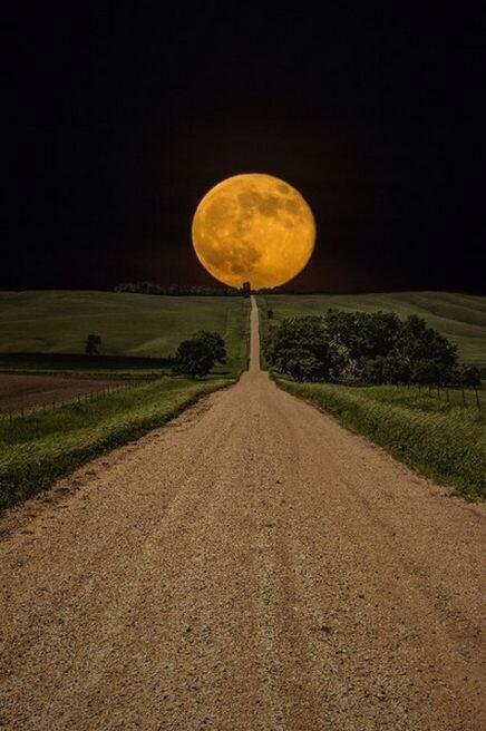 Supermoon rises over open road to nowhere in eastern South