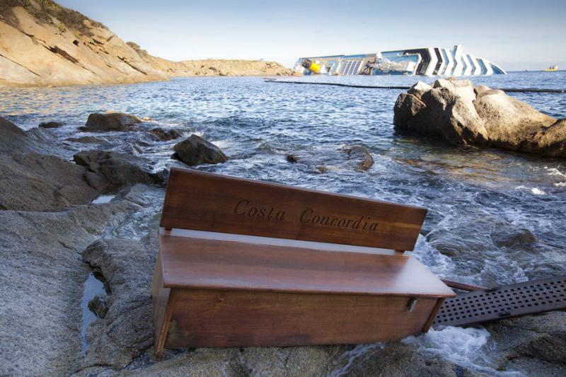 A bench engraved with the name of the grounded Costa Concordia cruise ship