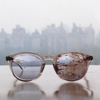 John Lennon's bloodstained glasses, photo made by Yoko Ono in 1980.