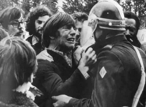 Two childhood friends meet during a demonstration.