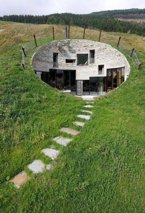 A modern house carved into a hill