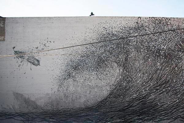 فنان صيني يبدع في الرسم على الجدران رسومات ثلاثية الأبعاد تبدو وكأنها صنعت من أسلاك معدنية #فن - صوره رقم 1