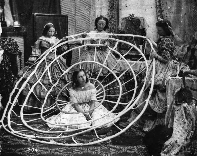 A woman waits for the hoops of her crinoline to be finished in a London dress shop in 1860 #History